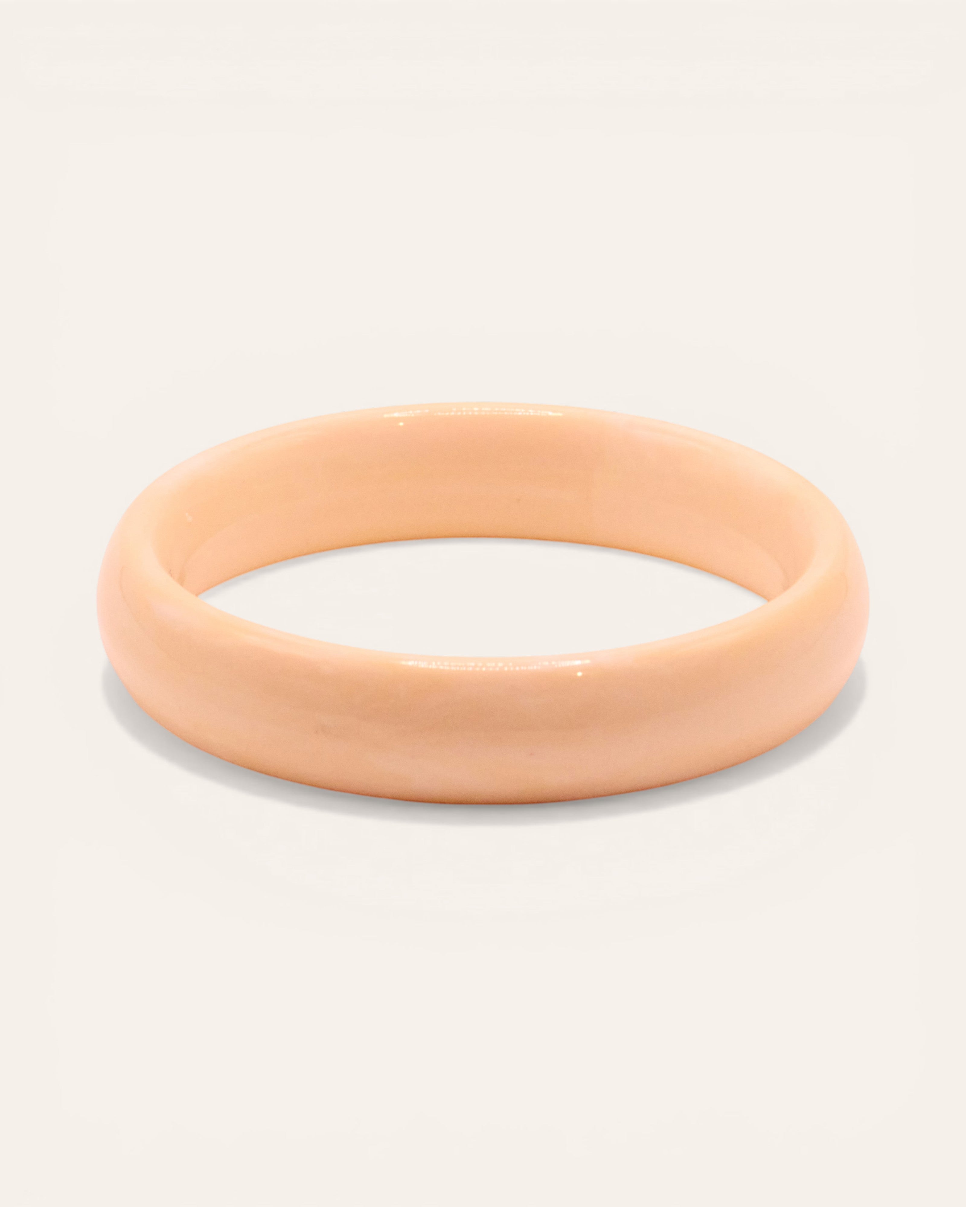 Aglaia cream resin bangle bracelet with unique marbled effect, medium size.