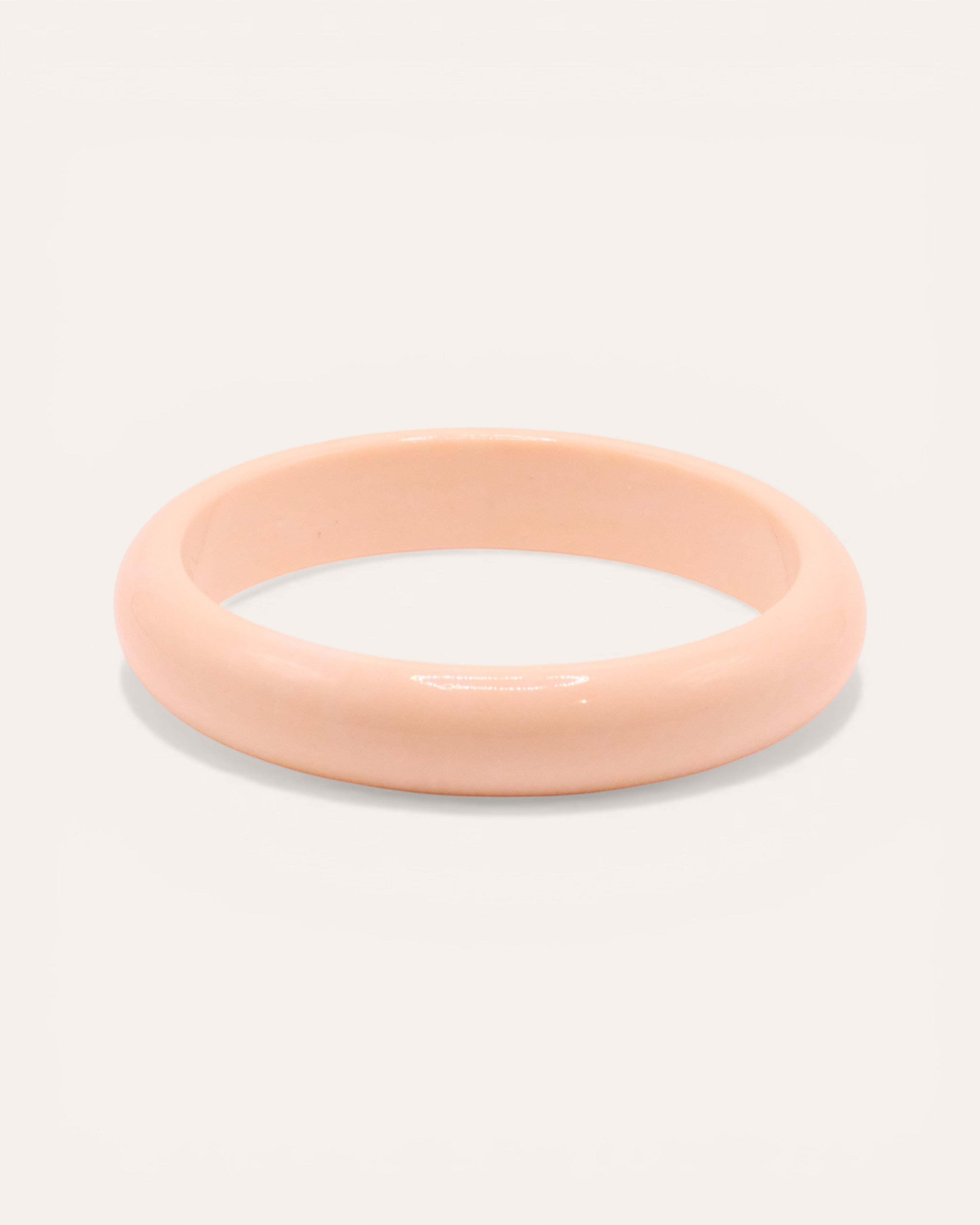 Aglaia fine ivory resin bangle with unique marbled effect, 65mm inner diameter.