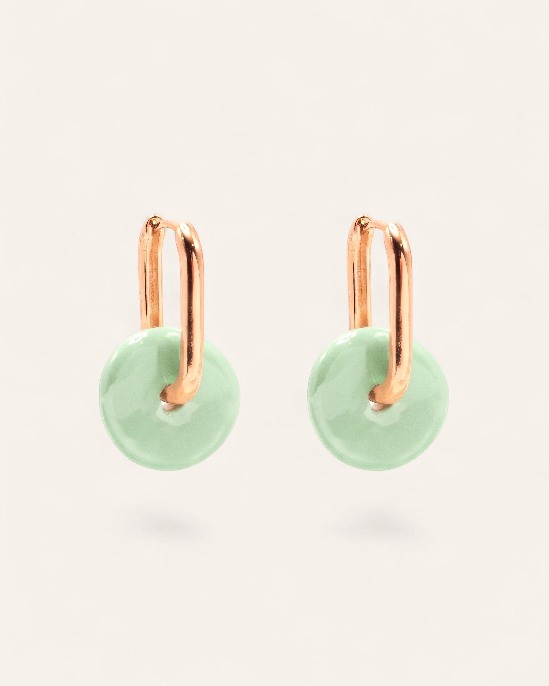 Aglaia Aurélia earrings: gold-plated brass hoops with removable mint green ceramic discs. Unique marbled design.