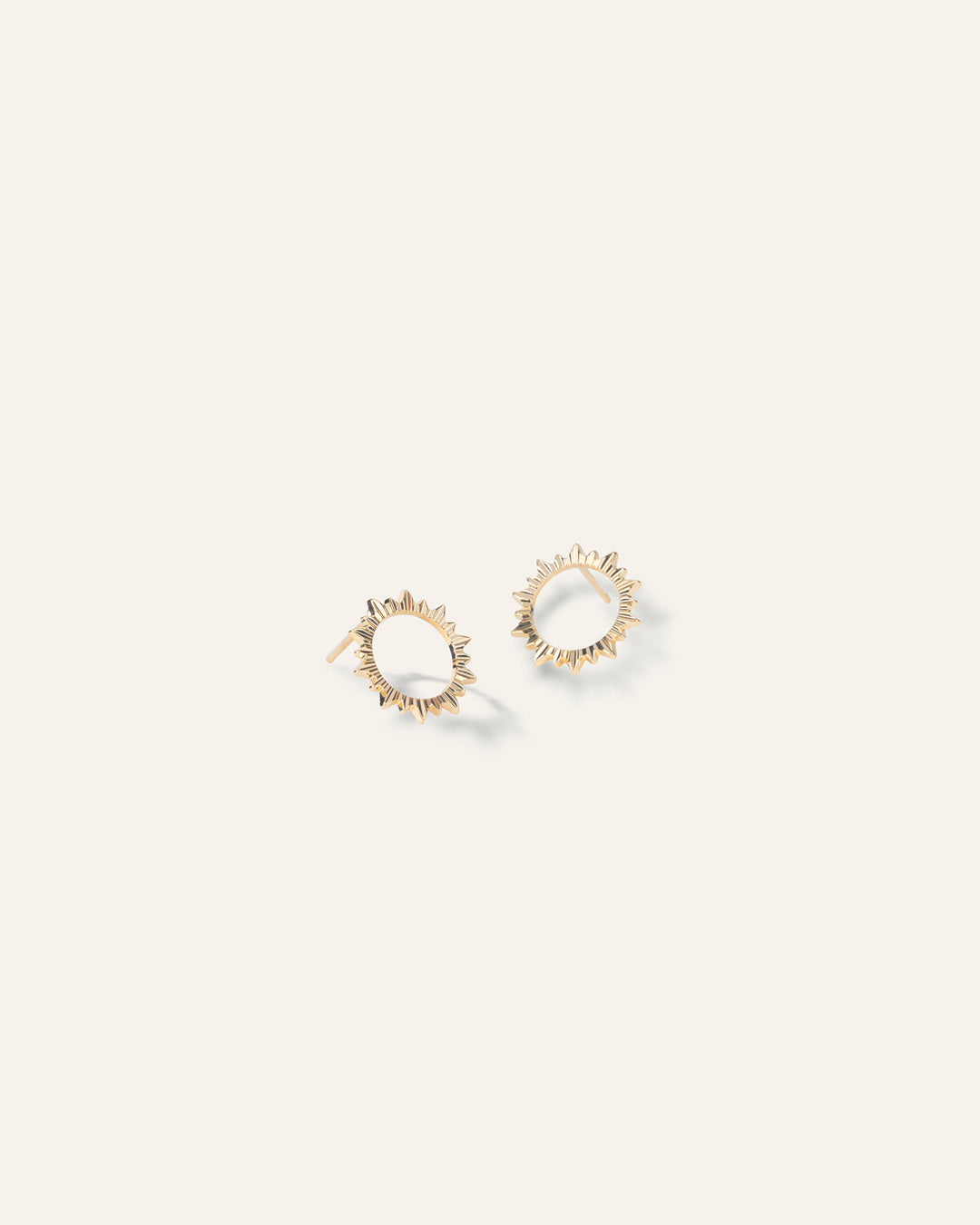Earrings featuring a sun-design ring, in 3-micron gold plating, made in France.
