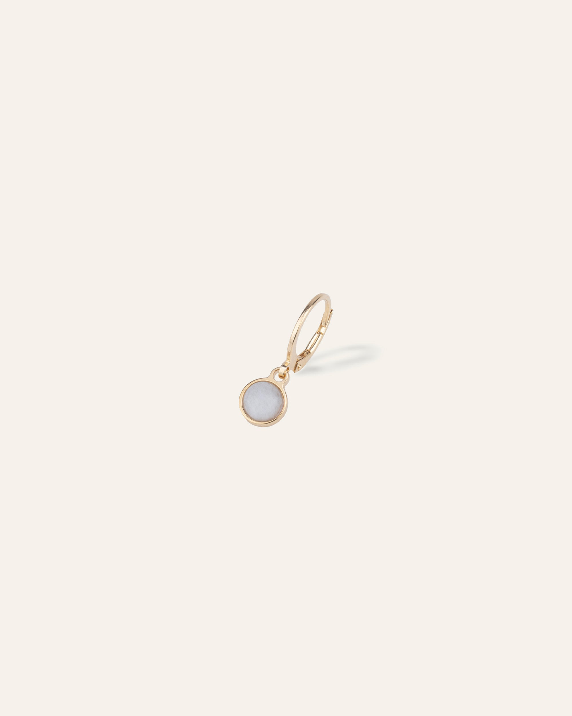 Sleeper earring, 3-micron gold-plated, set with a small round moonstone, made in France.